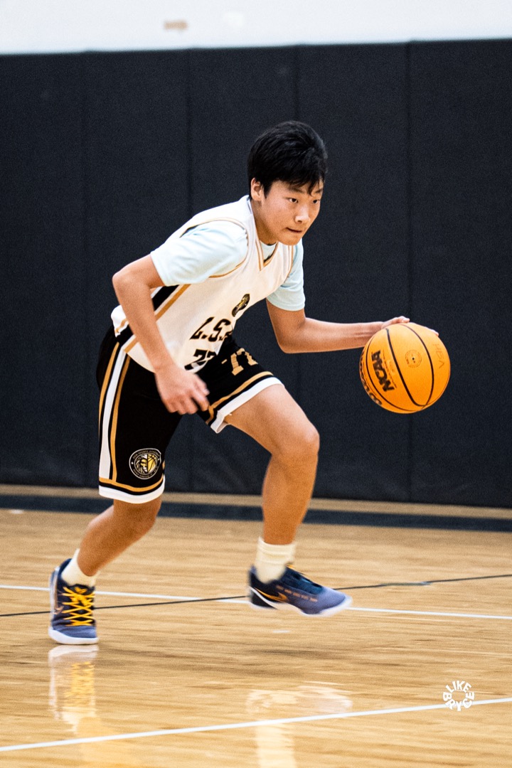 Young Zion player dribbling the ball on the court